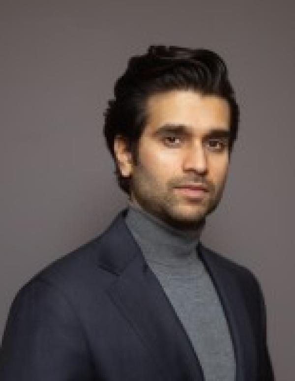 Harman Gill portrait studio shot with a grey background